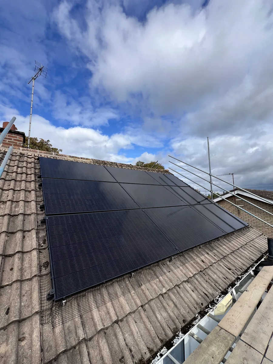 Close-up of solar panels freshly installed on a Cheltenham roof against a blue sky