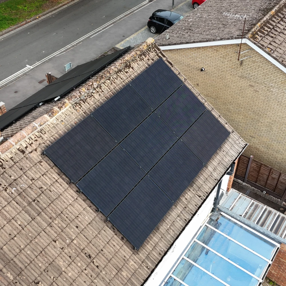 Closer aerial view of the solar panel array on a Cheltenham roof, overlooking the street